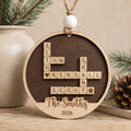 Personalized family crossword Christmas ornament featuring custom family names arranged in a crossword design with a personalized family name and year, handcrafted from Baltic birch.