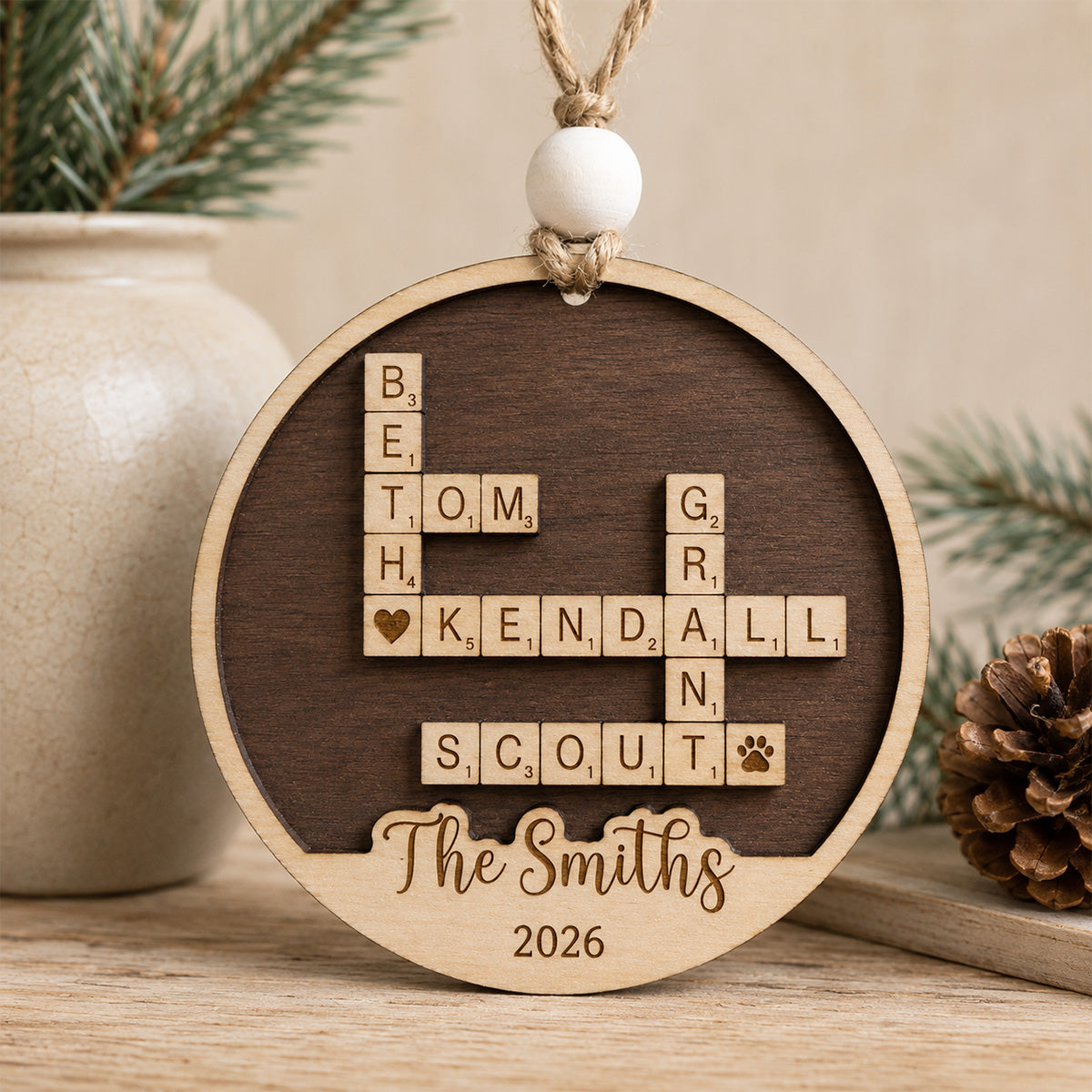 Personalized family crossword Christmas ornament featuring custom family names arranged in a crossword design with a personalized family name and year, handcrafted from Baltic birch.
