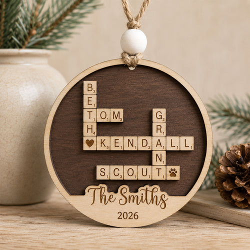 Personalized family crossword Christmas ornament featuring custom family names arranged in a crossword design with a personalized family name and year, handcrafted from Baltic birch.